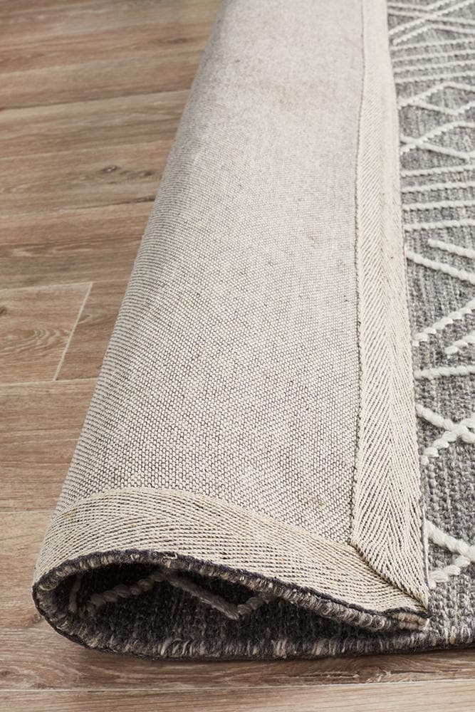 arya stitch woven silver grey rug folded