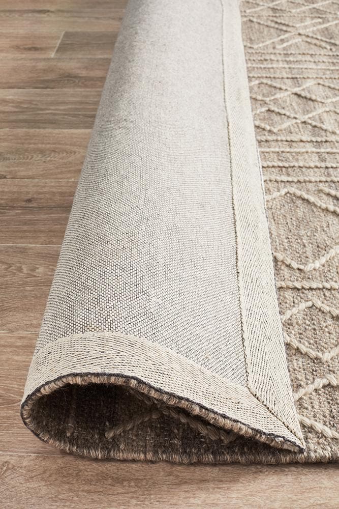 arya stitch woven natural rug folded