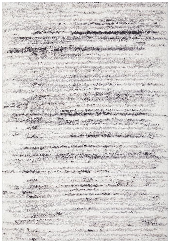 The Moonlight Gleam Rug is a luxurious and modern addition to any home. Its shaggy texture and plush